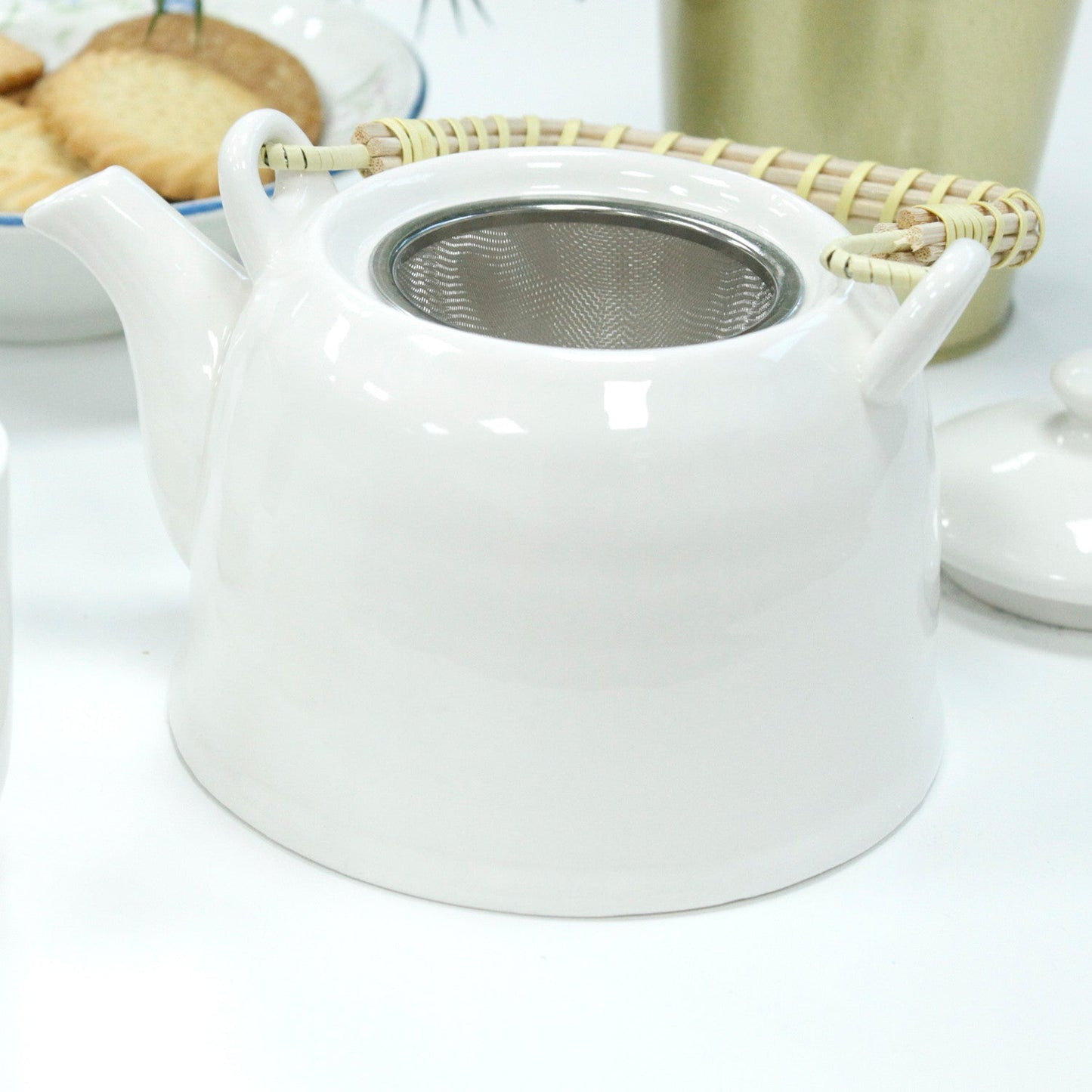 650ml Classic Design White Glazed Ceramic Herbal Teapot with a Strainer and a 6 Matching Cup Set product packaging on clean background from Quintessential Holistic Health Ltd