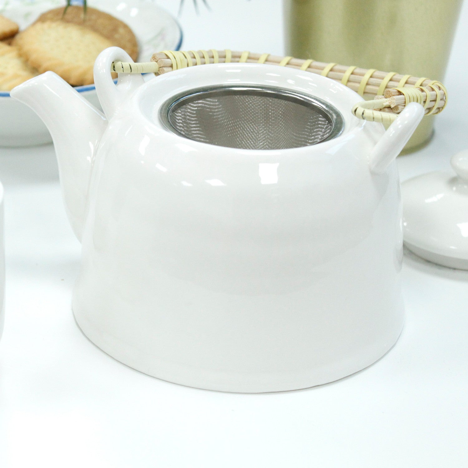 650ml Classic Design White Glazed Ceramic Herbal Teapot with a Strainer and a 6 Matching Cup Set product packaging on clean background from Quintessential Holistic Health Ltd