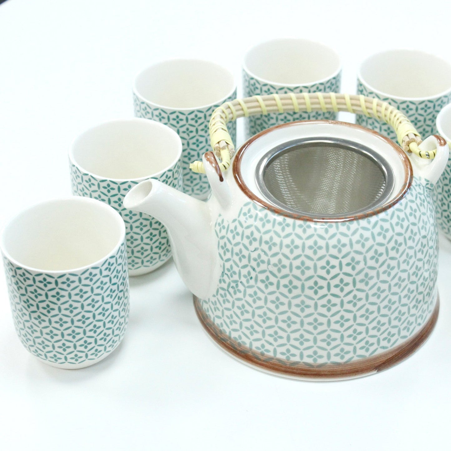650ml Green Mosaic Design White Ceramic Teapot with a Strainer and a 6 Matching Cup Set product packaging on clean background from Quintessential Holistic Health Ltd