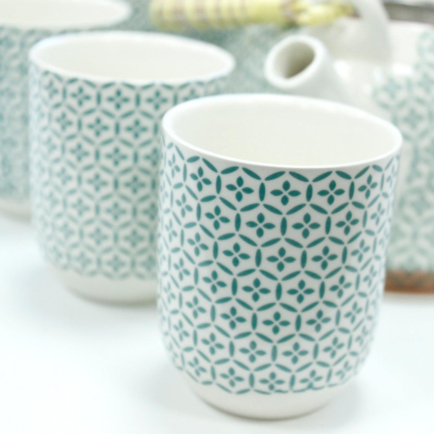 650ml Green Mosaic Design White Ceramic Teapot with a Strainer and a 6 Matching Cup Set product packaging on clean background from Quintessential Holistic Health Ltd