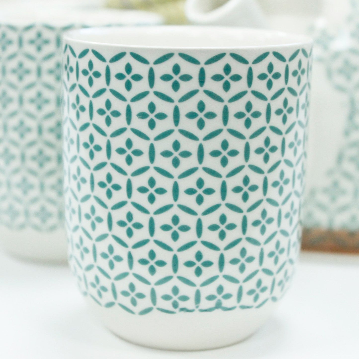 650ml Green Mosaic Design White Ceramic Teapot with a Strainer and a 6 Matching Cup Set product packaging on clean background from Quintessential Holistic Health Ltd