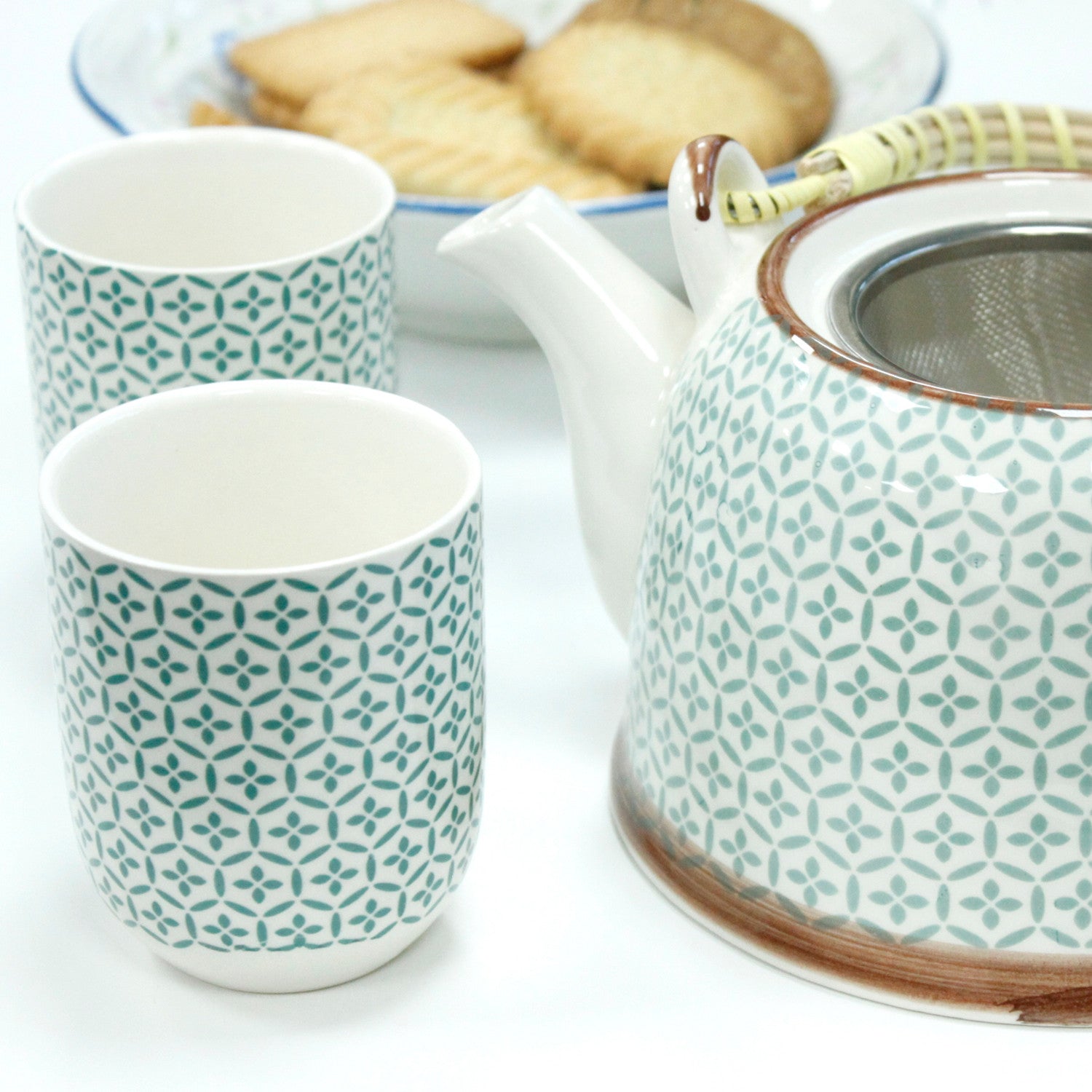 650ml Green Mosaic Design White Ceramic Teapot with a Strainer and a 6 Matching Cup Set product packaging on clean background from Quintessential Holistic Health Ltd