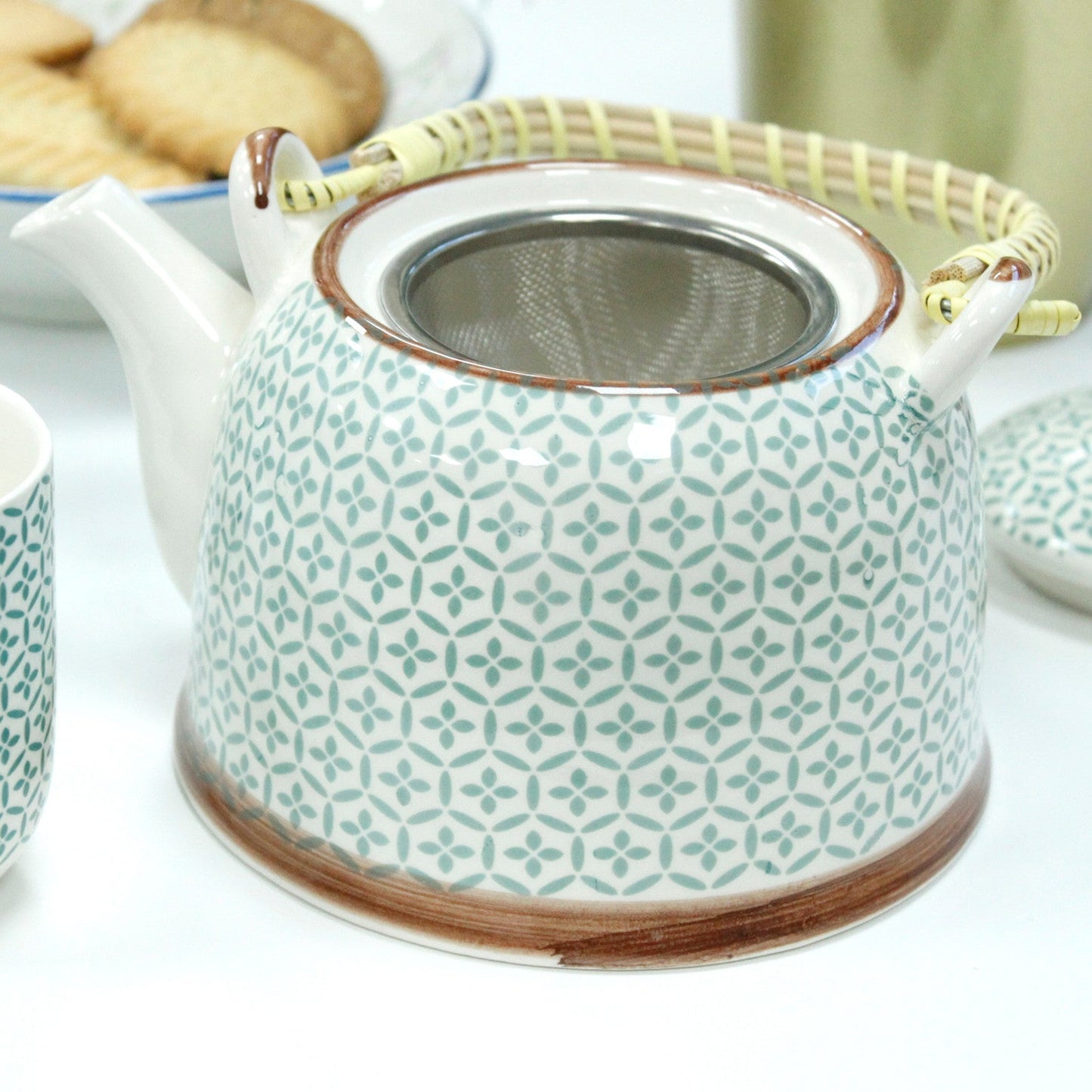 650ml Green Mosaic Design White Ceramic Teapot with a Strainer and a 6 Matching Cup Set product packaging on clean background from Quintessential Holistic Health Ltd