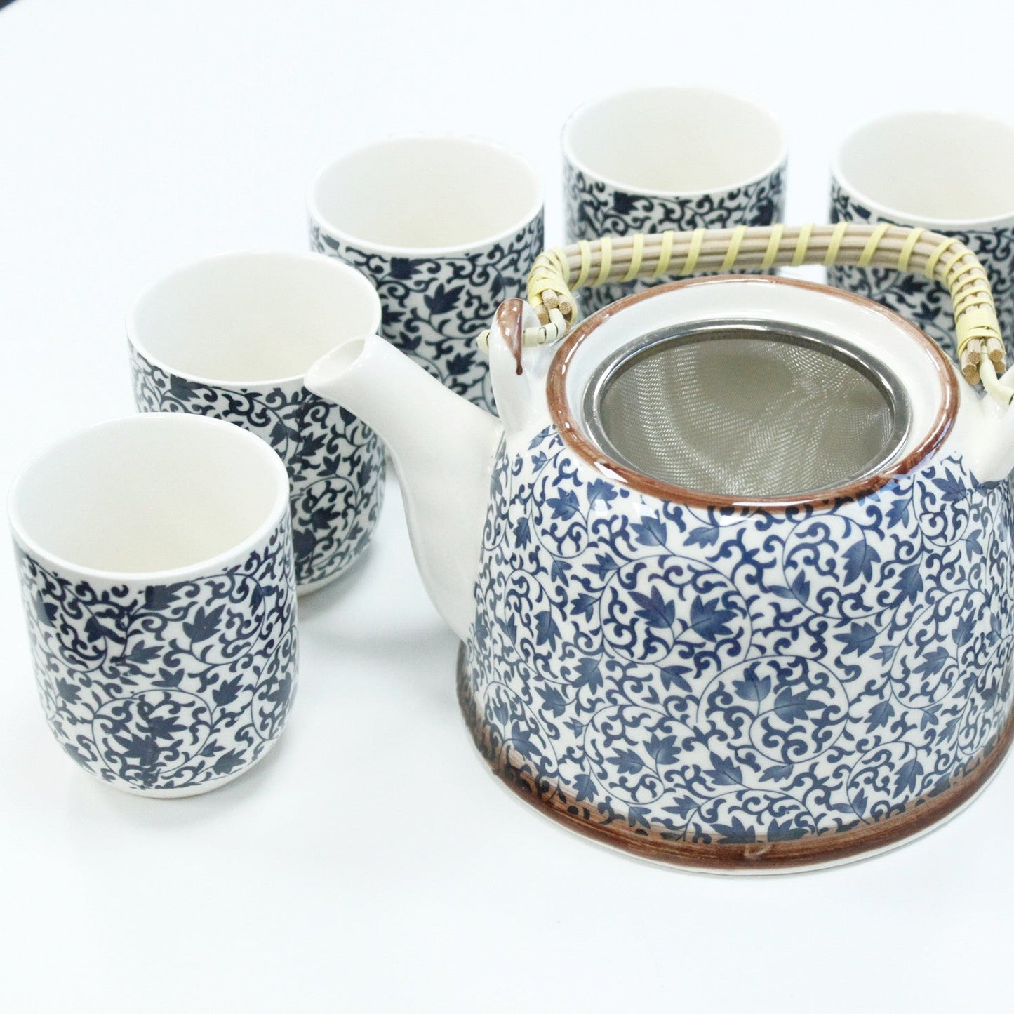650ml Blue Patterned Design White Ceramic Herbal Teapot with a Strainer and a 6 Matching Cup Set product packaging on clean background from Quintessential Holistic Health Ltd