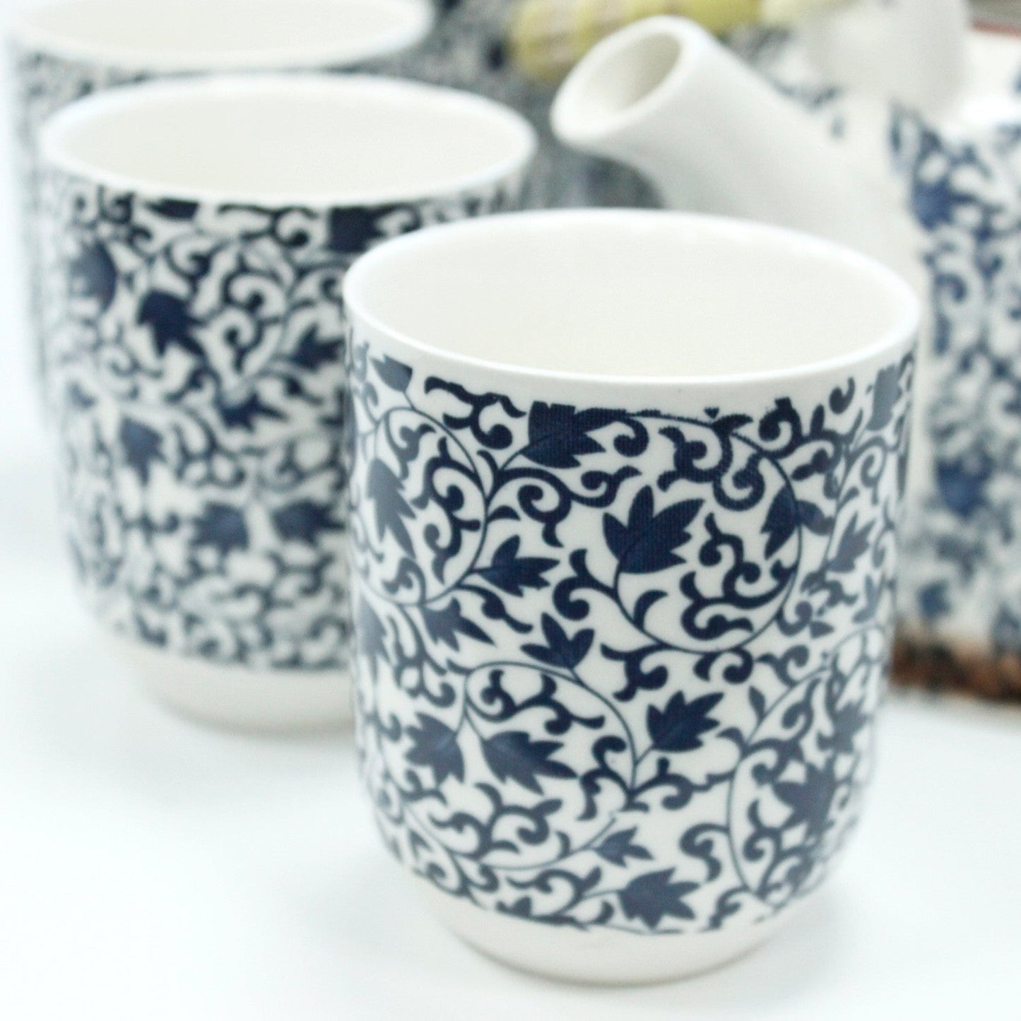 650ml Blue Patterned Design White Ceramic Herbal Teapot with a Strainer and a 6 Matching Cup Set product packaging on clean background from Quintessential Holistic Health Ltd