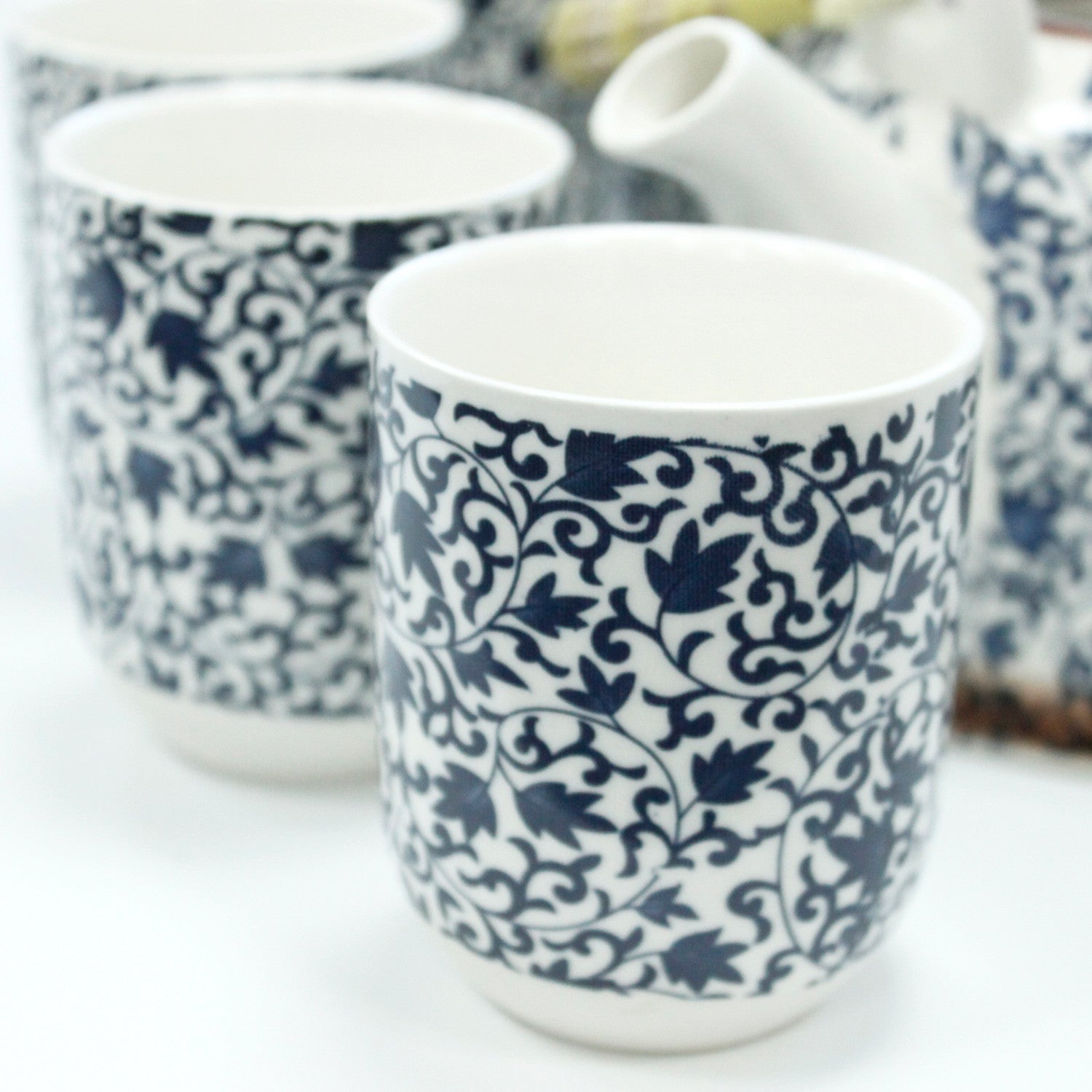 650ml Blue Patterned Design White Ceramic Herbal Teapot with a Strainer and a 6 Matching Cup Set product packaging on clean background from Quintessential Holistic Health Ltd