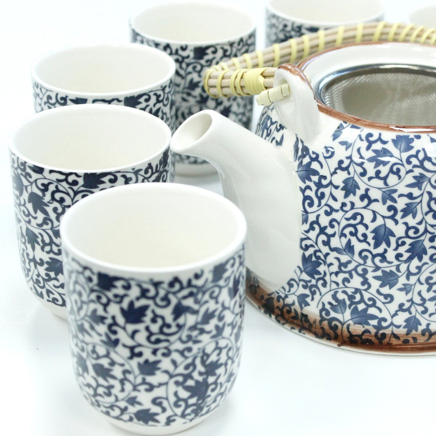 650ml Blue Patterned Design White Ceramic Herbal Teapot with a Strainer and a 6 Matching Cup Set product packaging on clean background from Quintessential Holistic Health Ltd