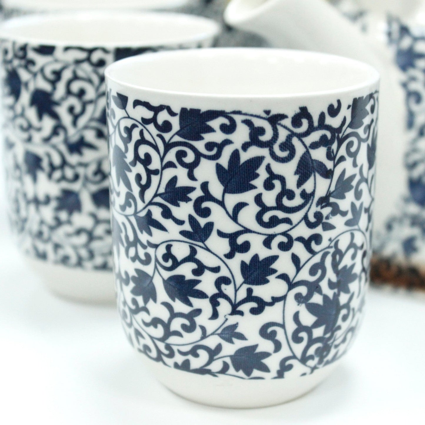 650ml Blue Patterned Design White Ceramic Herbal Teapot with a Strainer and a 6 Matching Cup Set product packaging on clean background from Quintessential Holistic Health Ltd