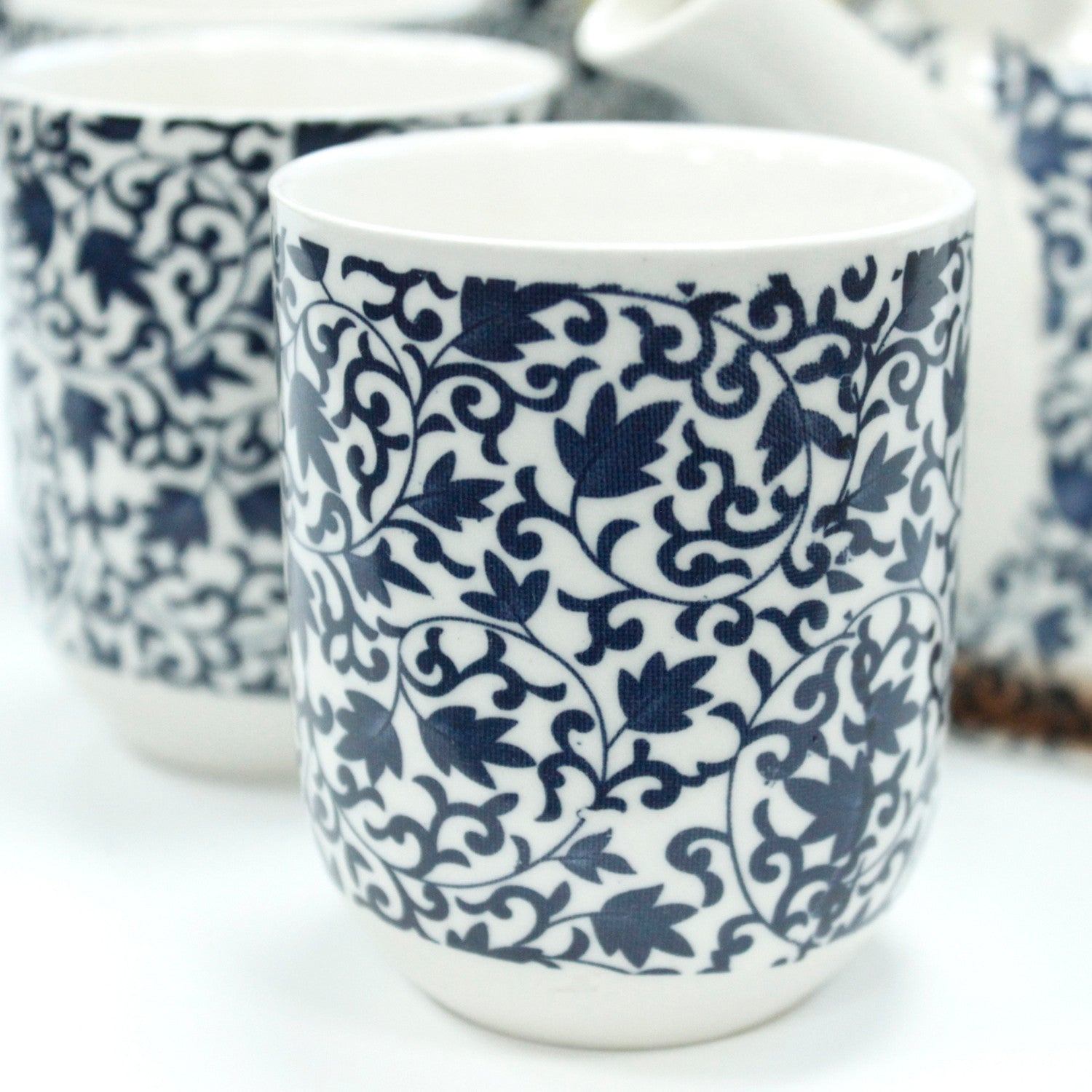 650ml Blue Patterned Design White Ceramic Herbal Teapot with a Strainer and a 6 Matching Cup Set product packaging on clean background from Quintessential Holistic Health Ltd