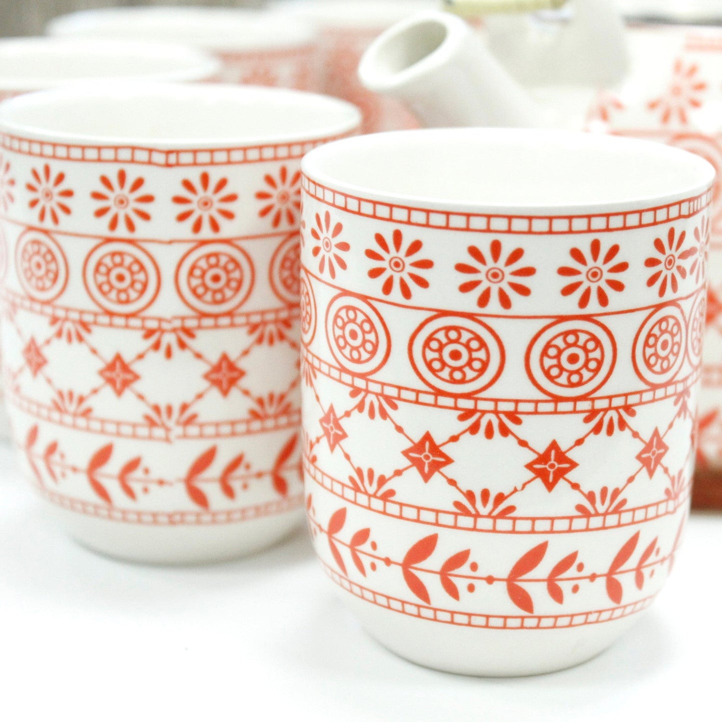 650ml Amber Design White Glazed Ceramic Herbal Teapot with a Strainer and a 6 Matching Cup Set product packaging on clean background from Quintessential Holistic Health Ltd