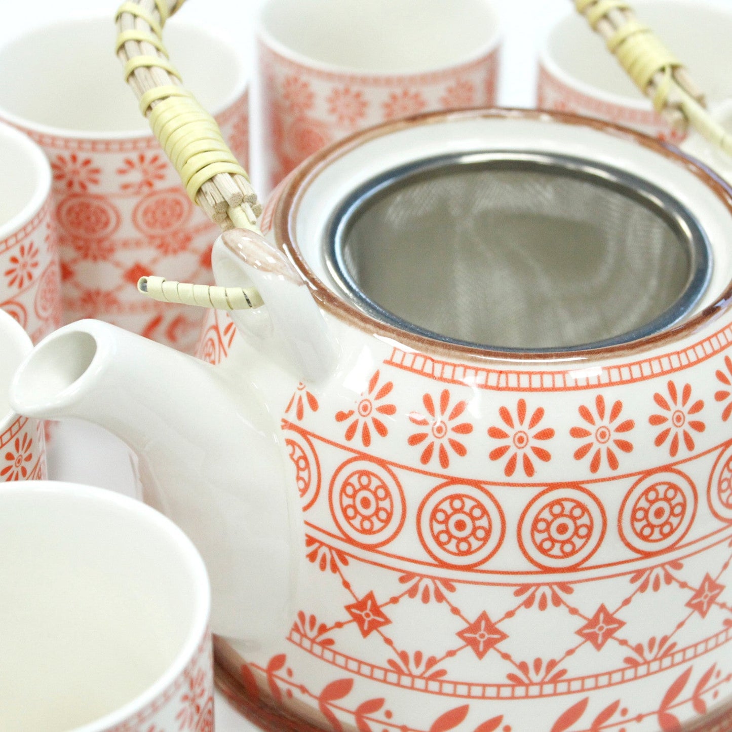 650ml Amber Design White Glazed Ceramic Herbal Teapot with a Strainer and a 6 Matching Cup Set product packaging on clean background from Quintessential Holistic Health Ltd