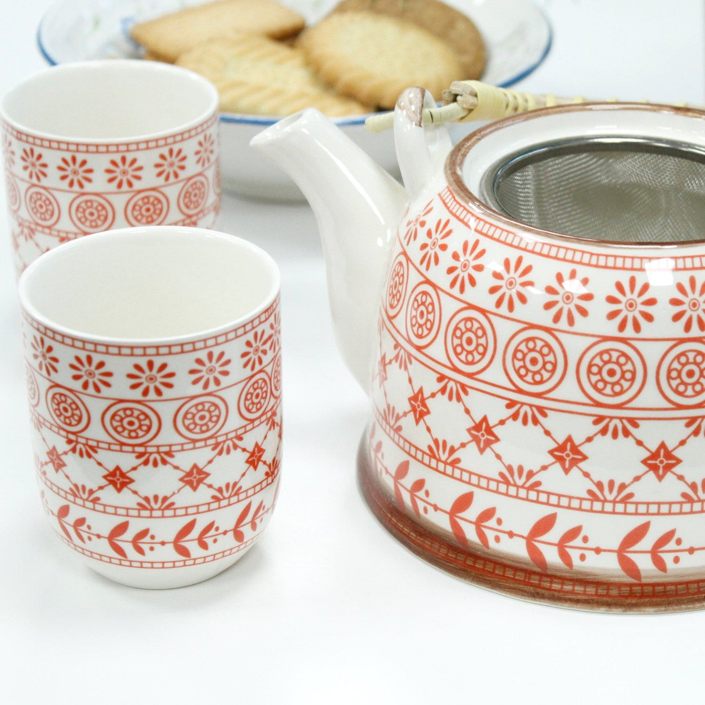650ml Amber Design White Glazed Ceramic Herbal Teapot with a Strainer and a 6 Matching Cup Set product packaging on clean background from Quintessential Holistic Health Ltd