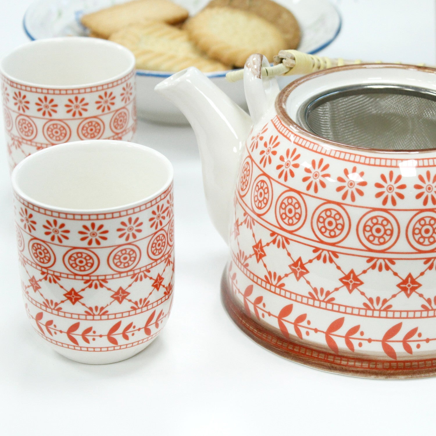 650ml Amber Design White Glazed Ceramic Herbal Teapot with a Strainer and a 6 Matching Cup Set product packaging on clean background from Quintessential Holistic Health Ltd