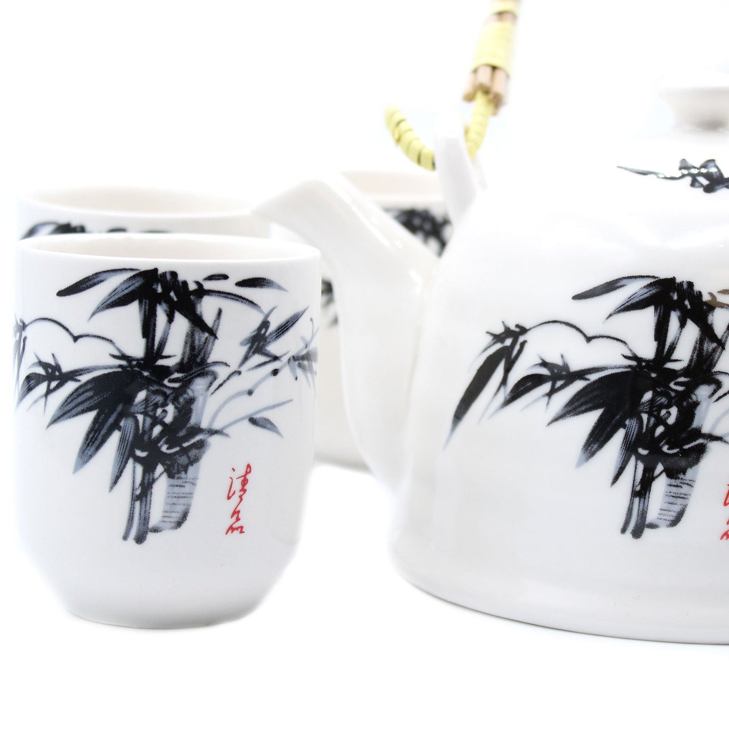 650ml Oriental Black Bamboo Design White Ceramic Teapot with a Strainer and a 6 Matching Cup Set product packaging on clean background from Quintessential Holistic Health Ltd