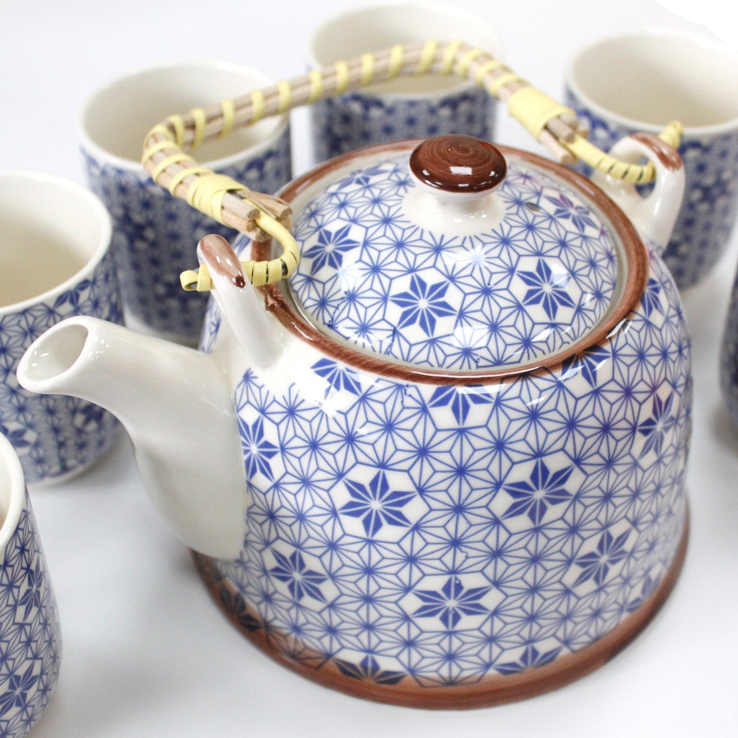 650ml Blue Star Design White Ceramic Herbal Teapot with a Strainer and a 6 Matching Cup Set product packaging on clean background from Quintessential Holistic Health Ltd