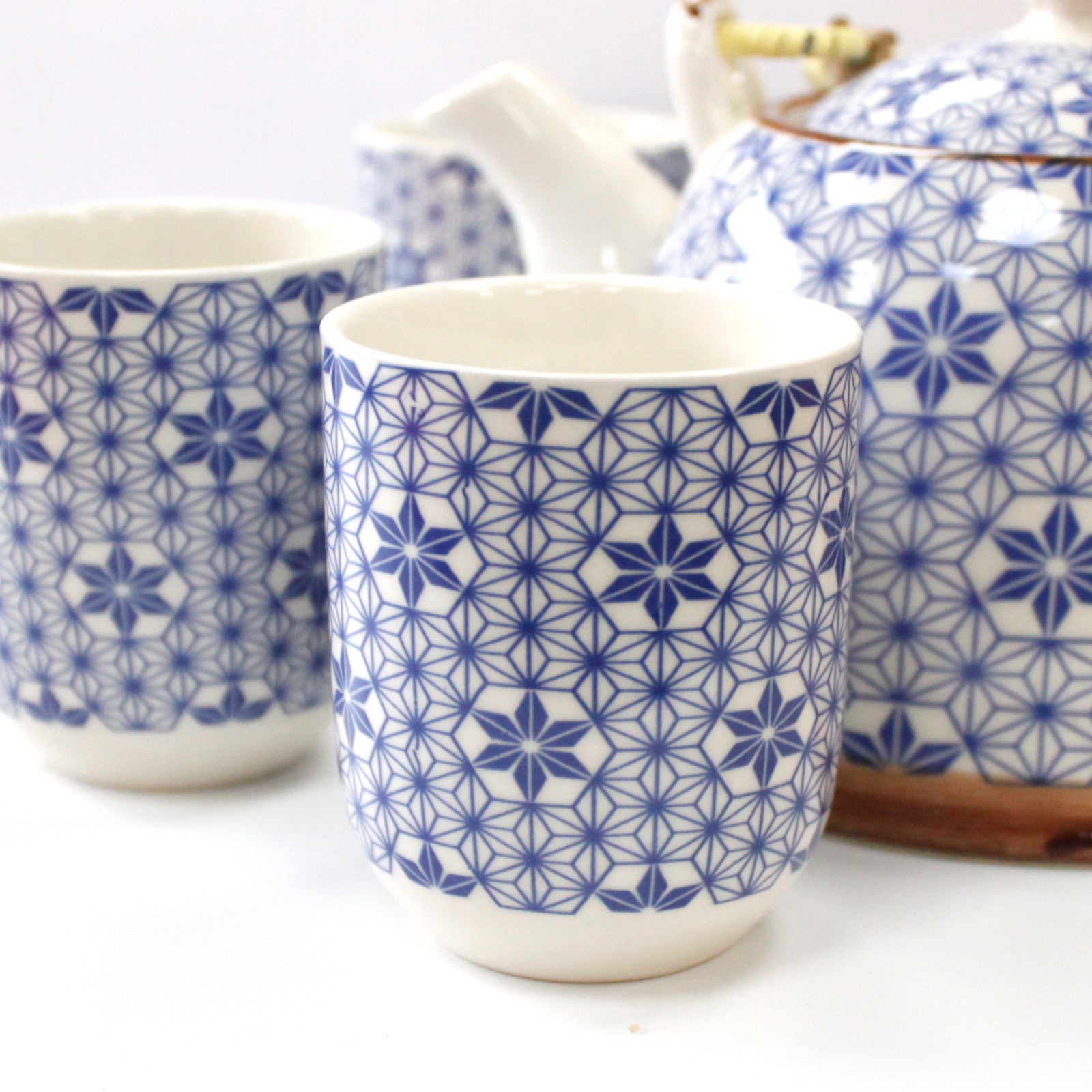 650ml Blue Star Design White Ceramic Herbal Teapot with a Strainer and a 6 Matching Cup Set product packaging on clean background from Quintessential Holistic Health Ltd