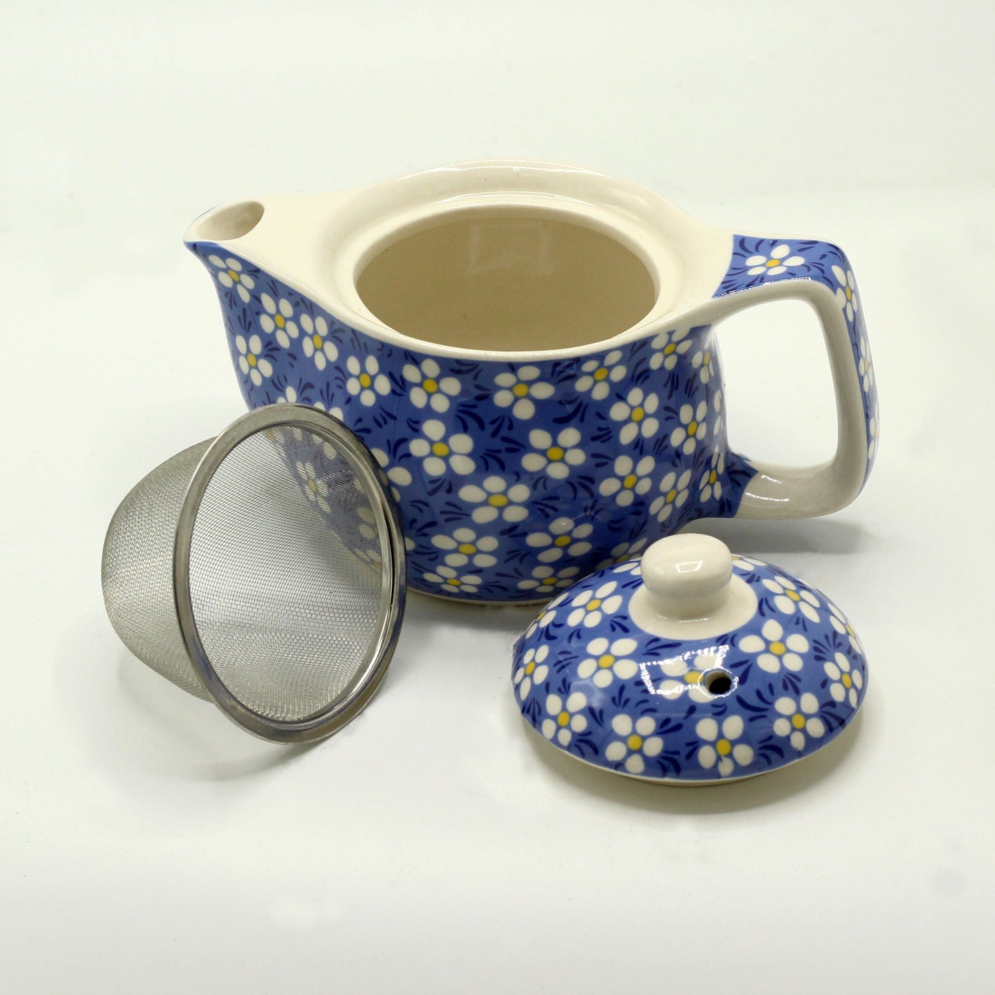 350ml Small Ceramic Blue Daisy Design Herbal Teapot and Strainer product packaging on clean background from Quintessential Holistic Health Ltd