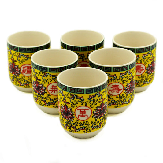 Ceramic Long Life Yellow Oriental Design Herbal Tea Cups - 6 Pack arranged upright with yellow, red, green and blue decoration by Quintessential Holistic Health Ltd