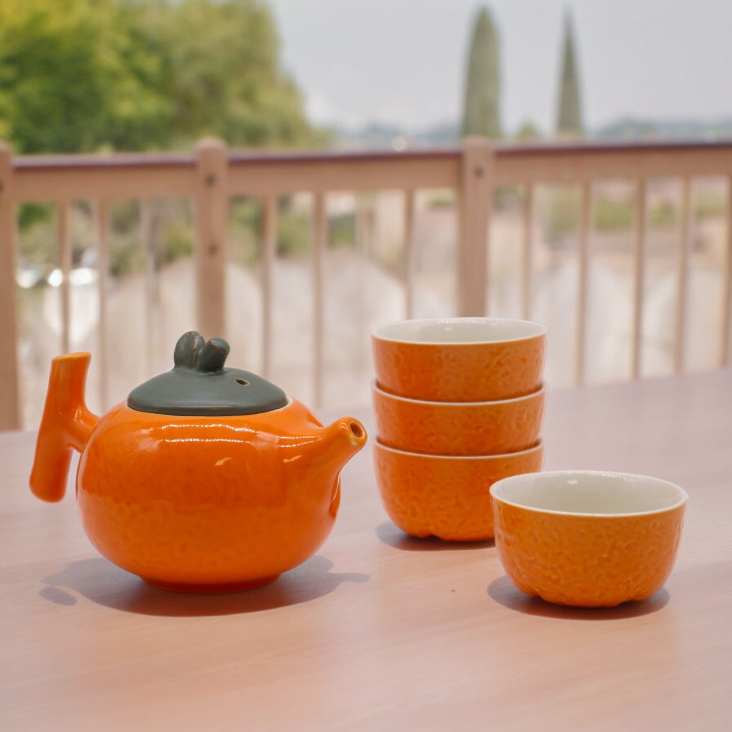 200ml Small Glazed Orange Ceramic Herbal Teapot with a 4 Matching Cup Set product packaging on clean background from Quintessential Holistic Health Ltd