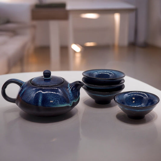 200ml Small Blue Glazed Ceramic Herbal Teapot with a 4 Matching Cup Set product packaging on clean background from Quintessential Holistic Health Ltd