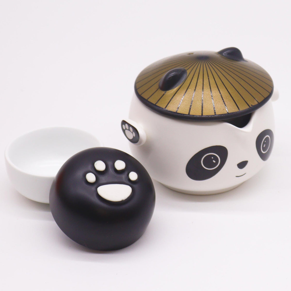 Kung Fu Panda Teapot Set - 2 Cups, Black/White, Orange Case, 210 ml with its gold-toned hat lid and black and white paw-print cups, by Quintessential Holistic Health Ltd