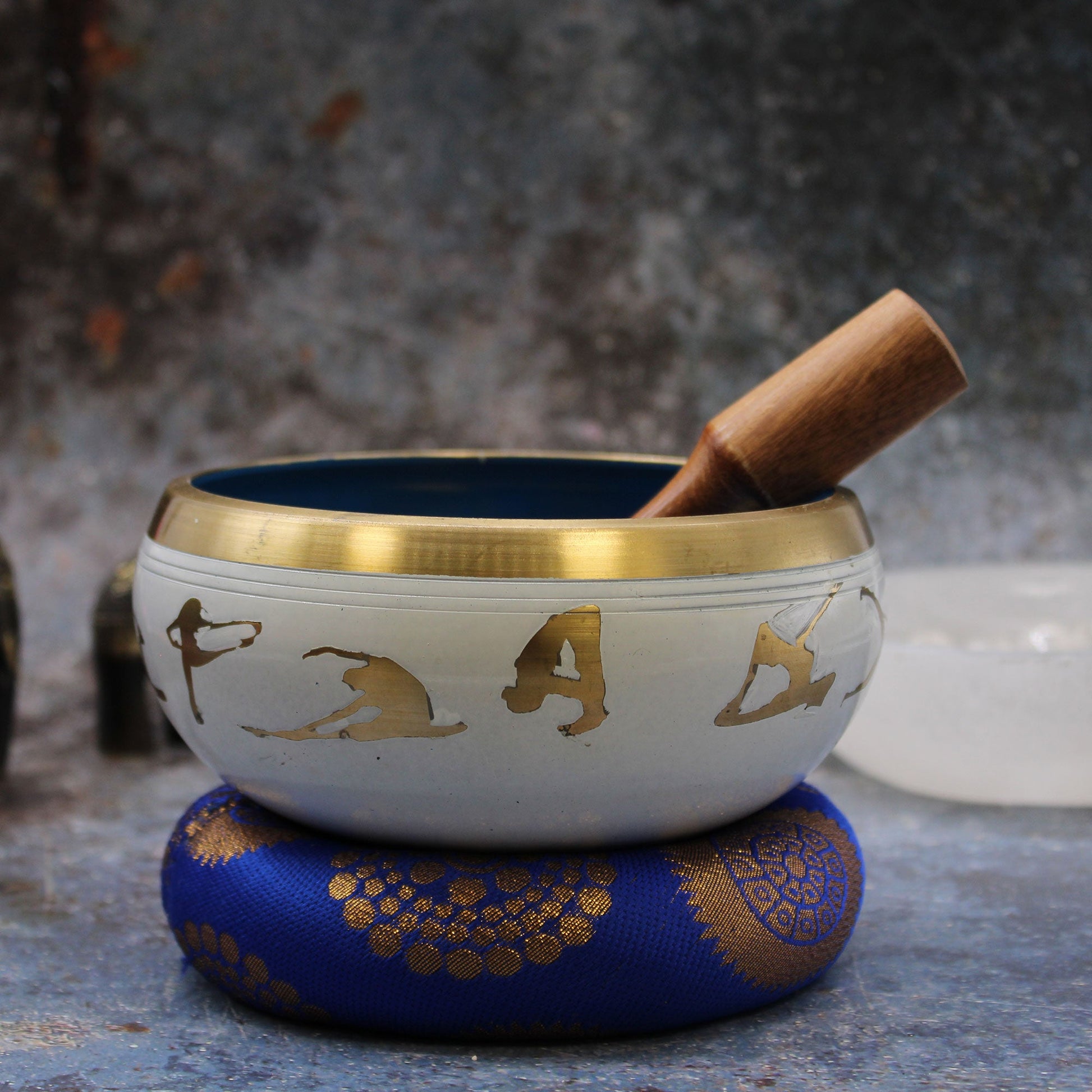 14cm Brass Singing Bowl Set - Yoga Poses / White and Blue product packaging on clean background from Quintessential Holistic Health Ltd