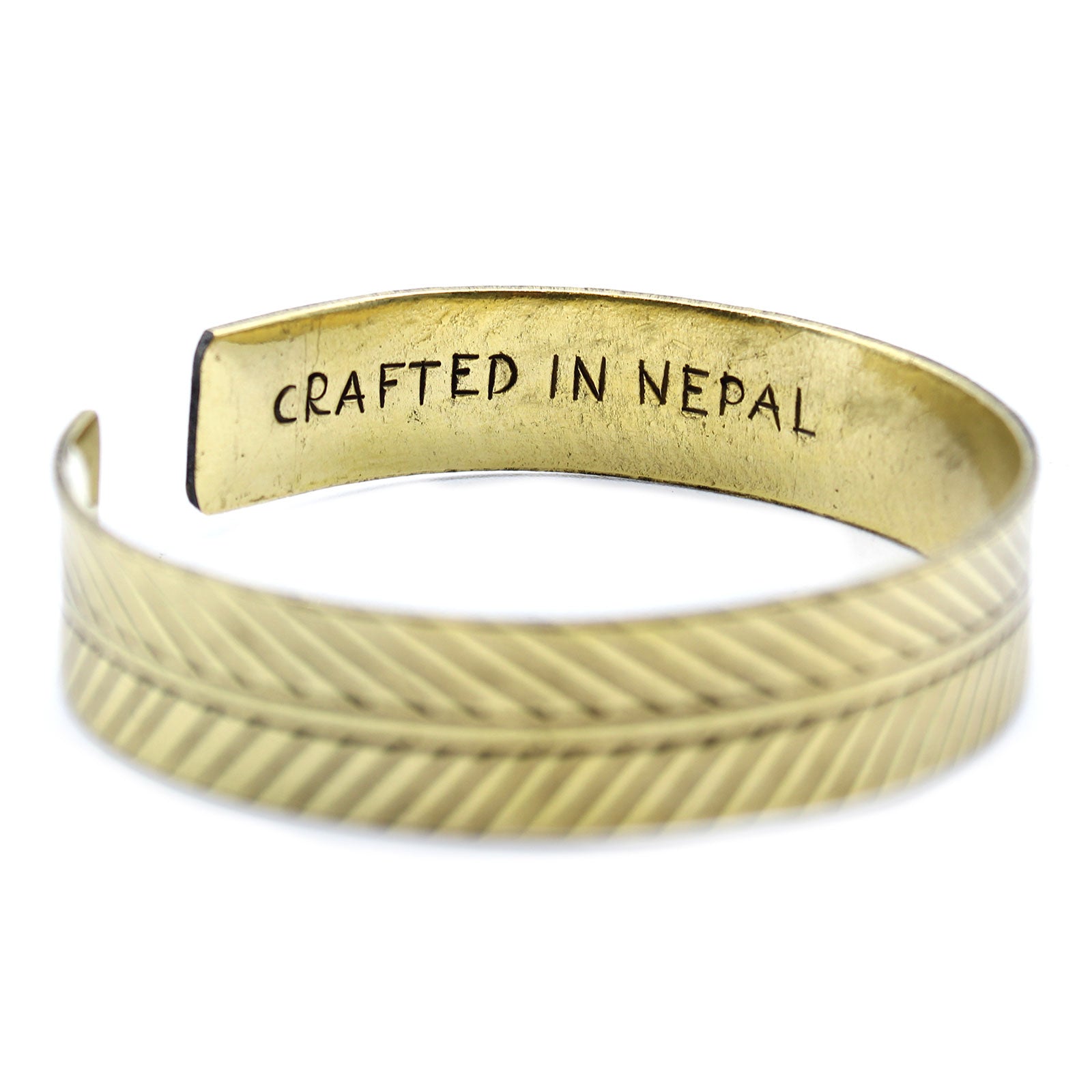 Handcrafted Brass Tibetan Bracelet - Wide Tribal Leaf product packaging on clean background from Quintessential Holistic Health Ltd