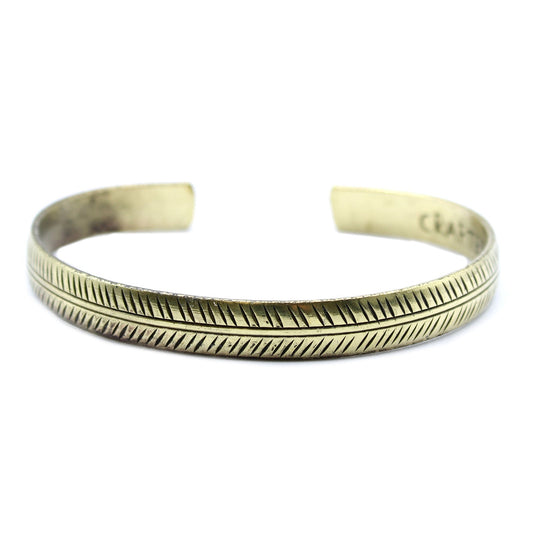Handcrafted Brass Tibetan Bracelet - Slim Tribal Leaf product packaging on clean background from Quintessential Holistic Health Ltd