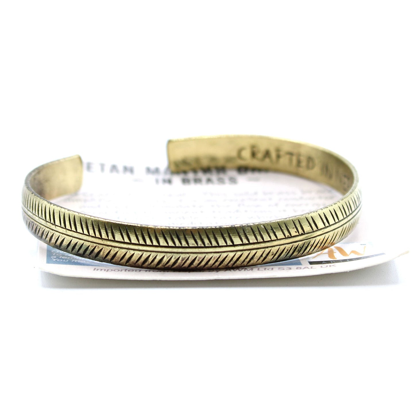 Handcrafted Brass Tibetan Bracelet - Slim Tribal Leaf product packaging on clean background from Quintessential Holistic Health Ltd