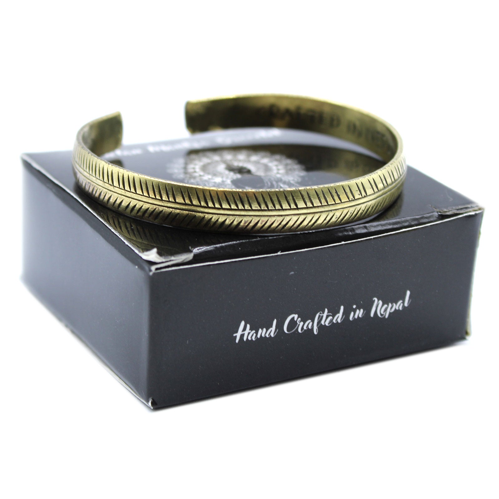 Handcrafted Brass Tibetan Bracelet - Slim Tribal Leaf product packaging on clean background from Quintessential Holistic Health Ltd