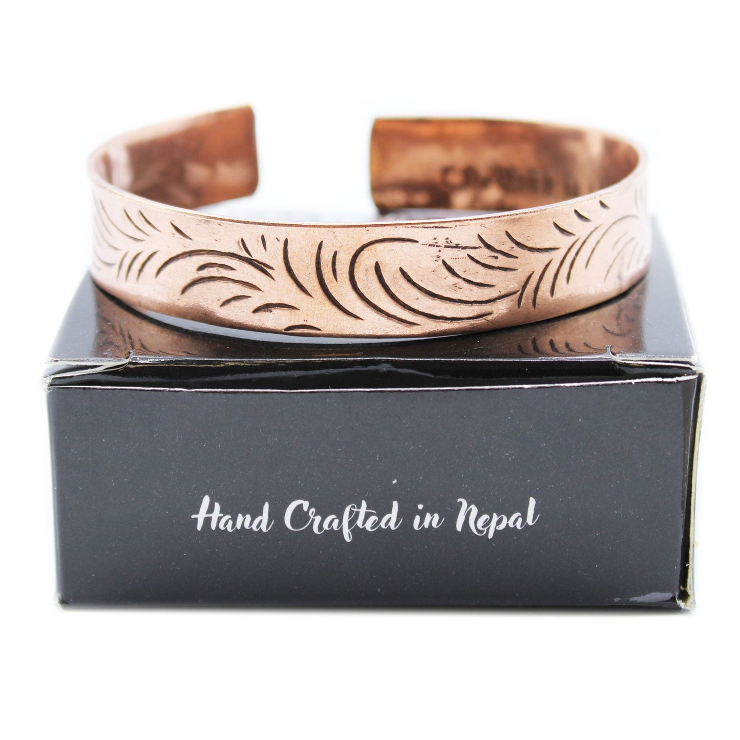 Handcrafted Copper Tibetan Bracelet - Wide Tribal Swirls product packaging on clean background from Quintessential Holistic Health Ltd
