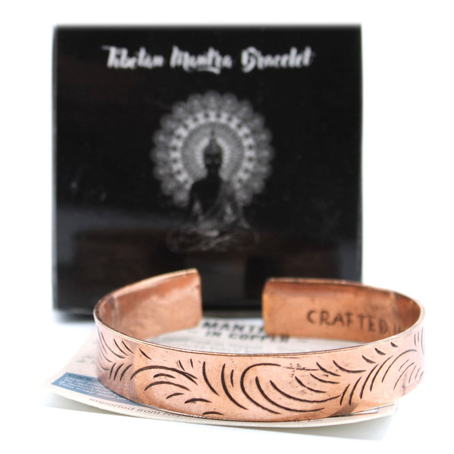 Handcrafted Copper Tibetan Bracelet - Wide Tribal Swirls product packaging on clean background from Quintessential Holistic Health Ltd