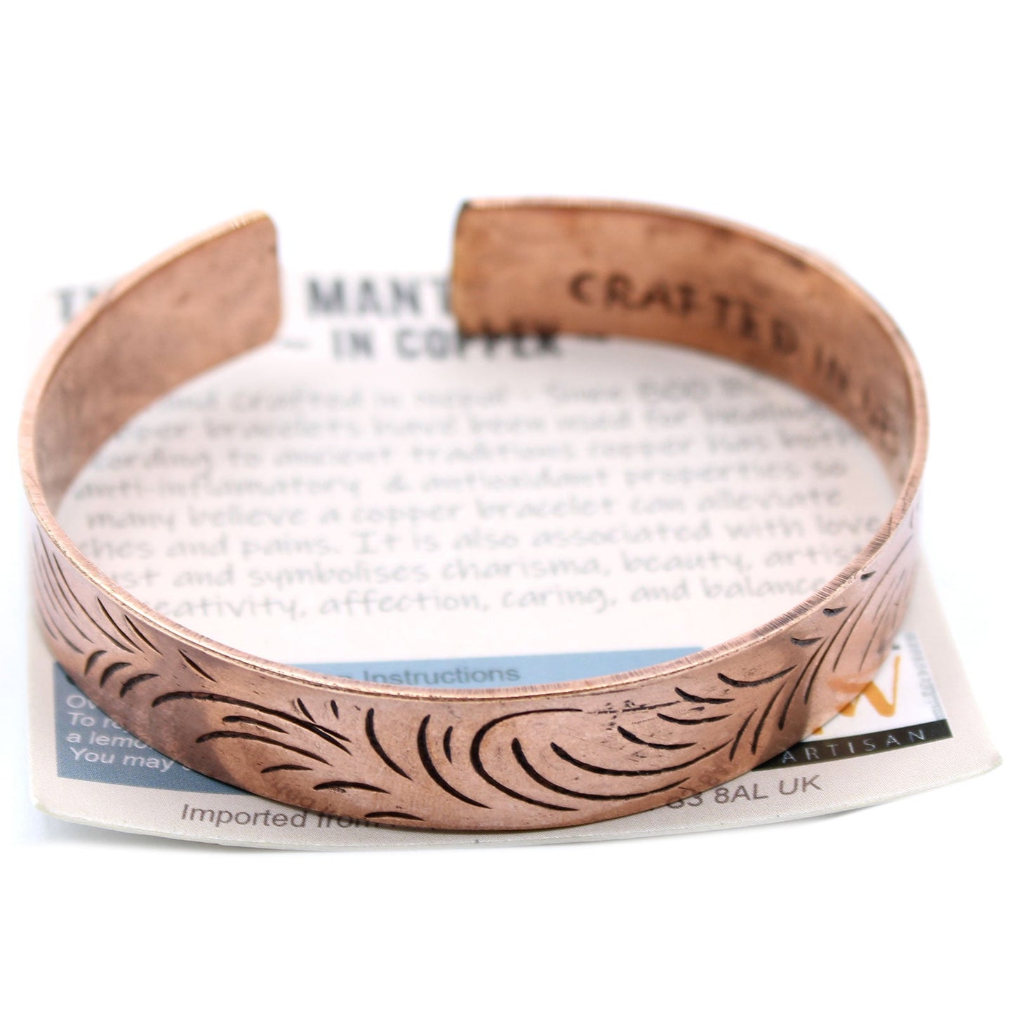 Handcrafted Copper Tibetan Bracelet - Wide Tribal Swirls product packaging on clean background from Quintessential Holistic Health Ltd
