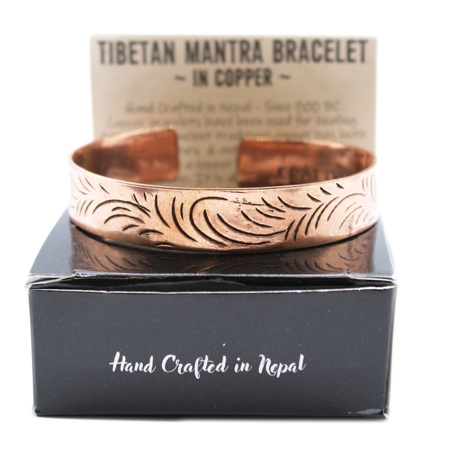 Handcrafted Copper Tibetan Bracelet - Wide Tribal Swirls product packaging on clean background from Quintessential Holistic Health Ltd