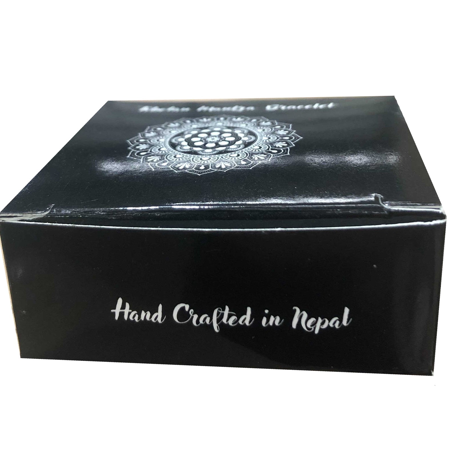 Handcrafted Copper Tibetan Bracelet - Slim Tribal Swirls product packaging on clean background from Quintessential Holistic Health Ltd