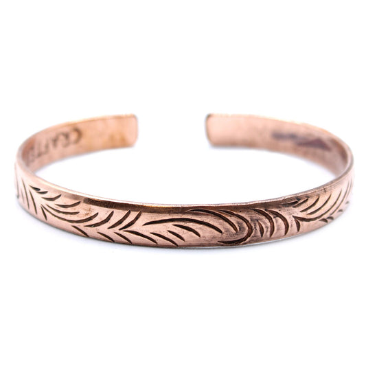 Handcrafted Copper Tibetan Bracelet - Slim Tribal Swirls product packaging on clean background from Quintessential Holistic Health Ltd