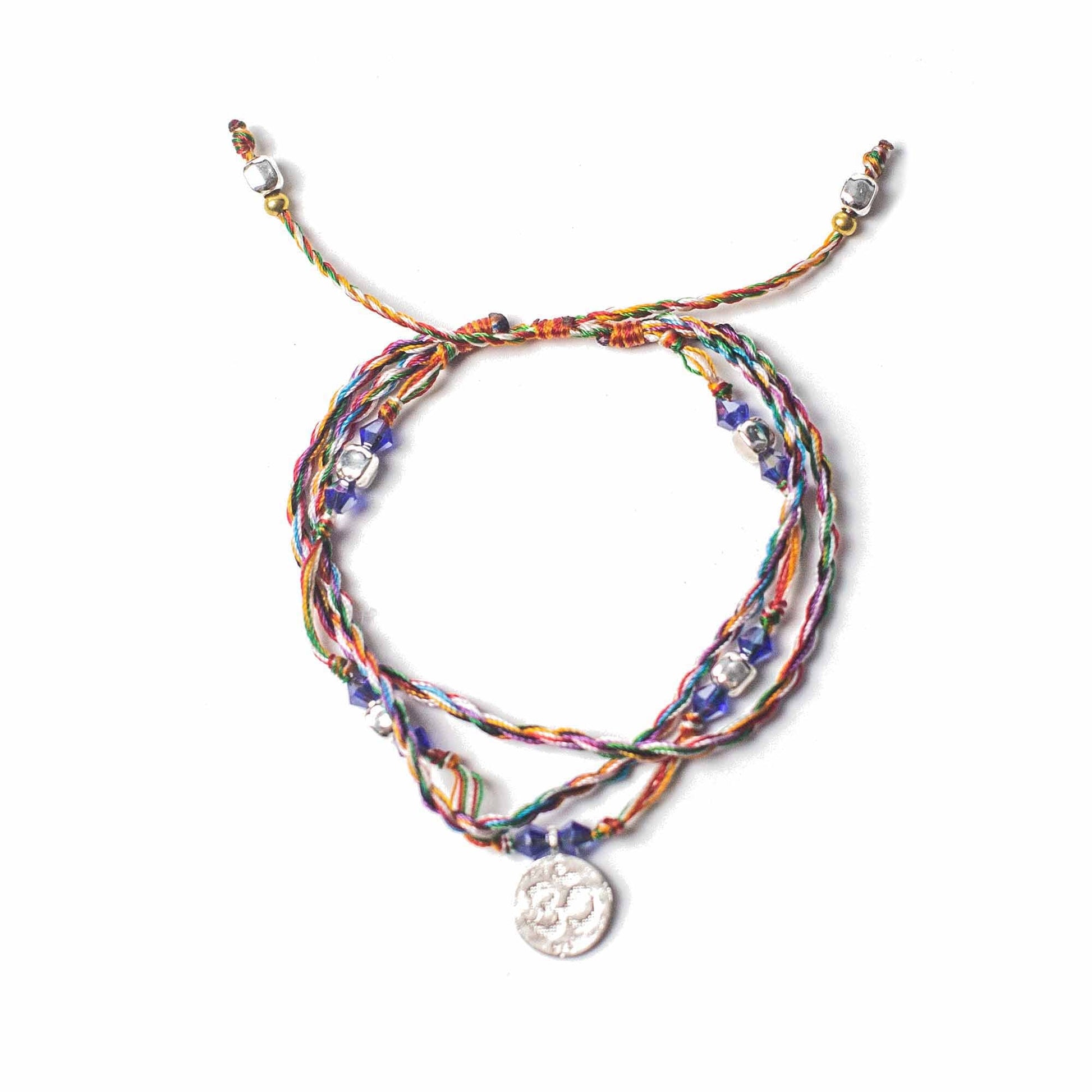 Handcrafted Temple String Bracelet - Om in Serenity product packaging on clean background from Quintessential Holistic Health Ltd