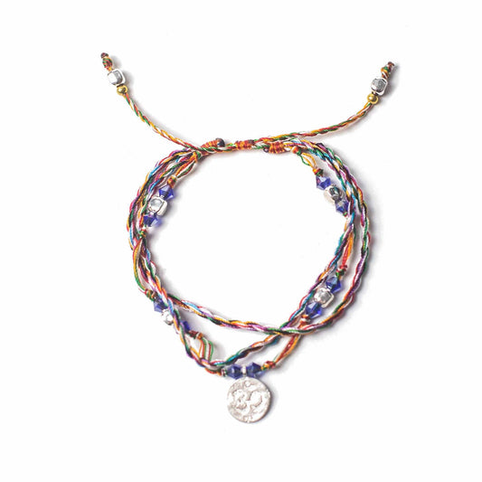 Handcrafted Temple String Bracelet - Om in Serenity product packaging on clean background from Quintessential Holistic Health Ltd