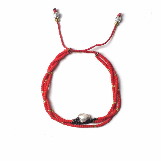 Handcrafted Temple String Bracelet - Unconditional Love product packaging on clean background from Quintessential Holistic Health Ltd