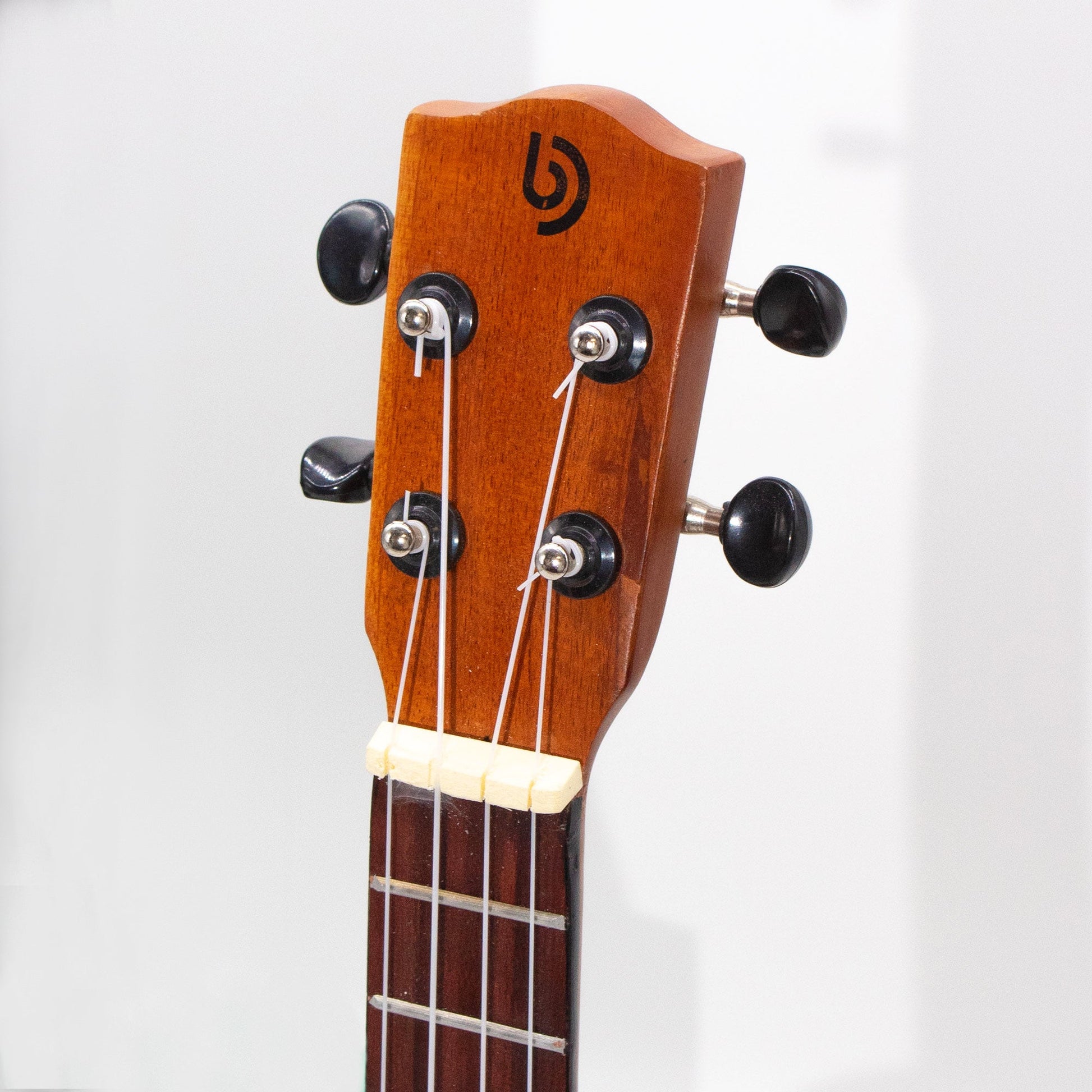 Artisan Handmade 4 String Rosewood Ukulele - Orange Sunburst product packaging on clean background from Quintessential Holistic Health Ltd