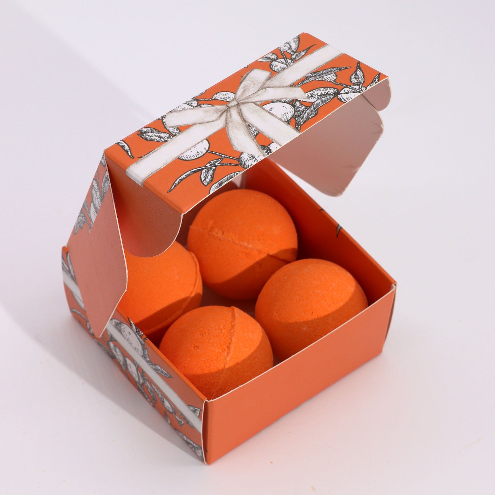Set of 4 Vitamin C Skincare Bath Bombs - Aromatherapy Quartet, open orange patterned box containing four orange spheres by Quintessential Holistic Health Ltd