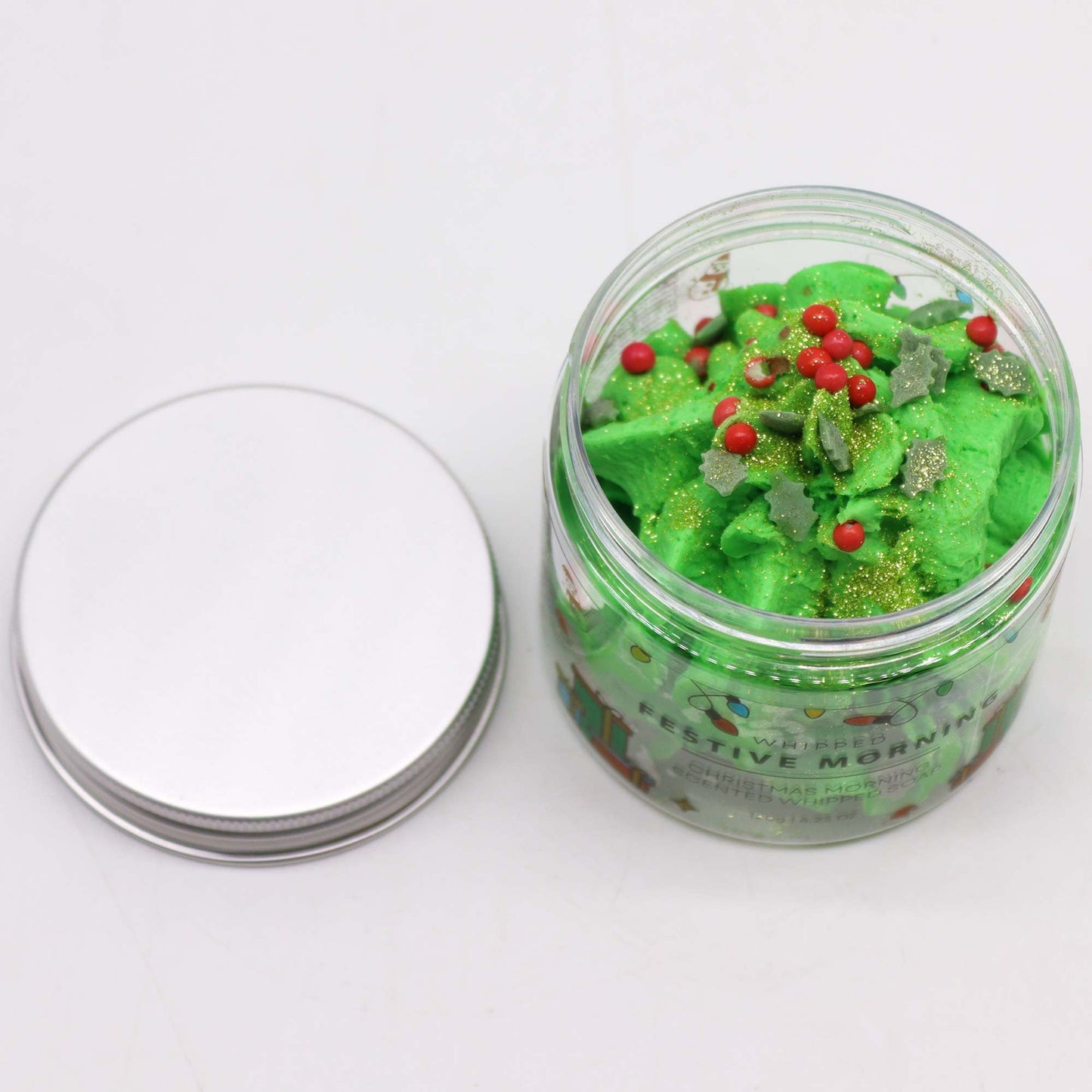 Handcrafted Vegan Friendly Whipped Soap - Festive Morning, open jar of green swirls with red beads and gold flecks by Quintessential Holistic Health Ltd