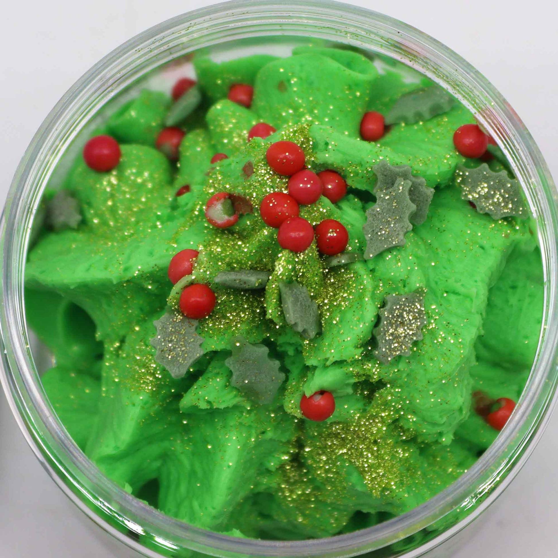 Handcrafted Vegan Friendly Whipped Soap - Festive Morning, close-up of green swirls topped with red beads and gold flecks by Quintessential Holistic Health Ltd