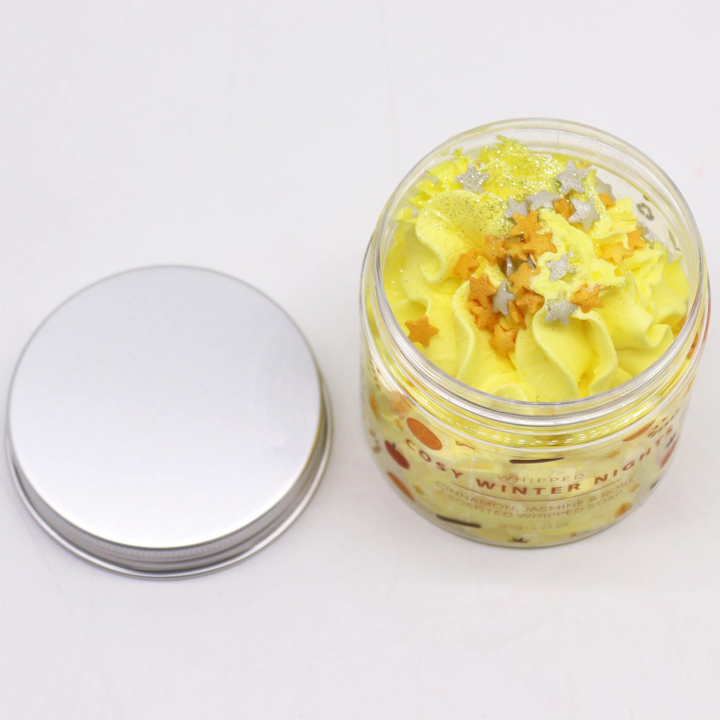 Handcrafted Vegan Friendly Whipped Soap - Cosy Winter Nights in an open clear jar beside its silver lid by Quintessential Holistic Health Ltd