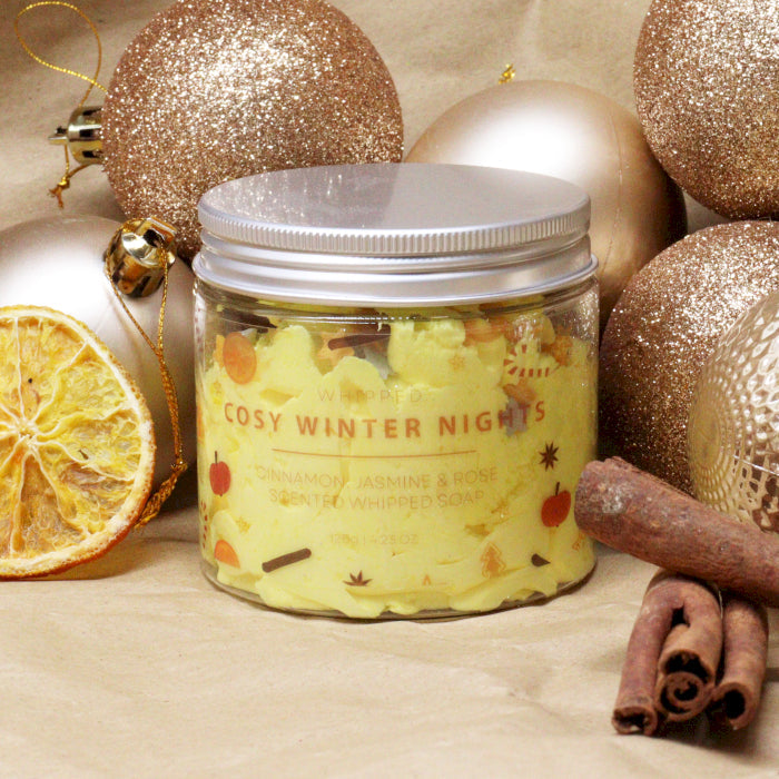 Handcrafted Vegan Friendly Whipped Soap - Cosy Winter Nights in a closed labelled jar beside dried orange and cinnamon sticks by Quintessential Holistic Health Ltd