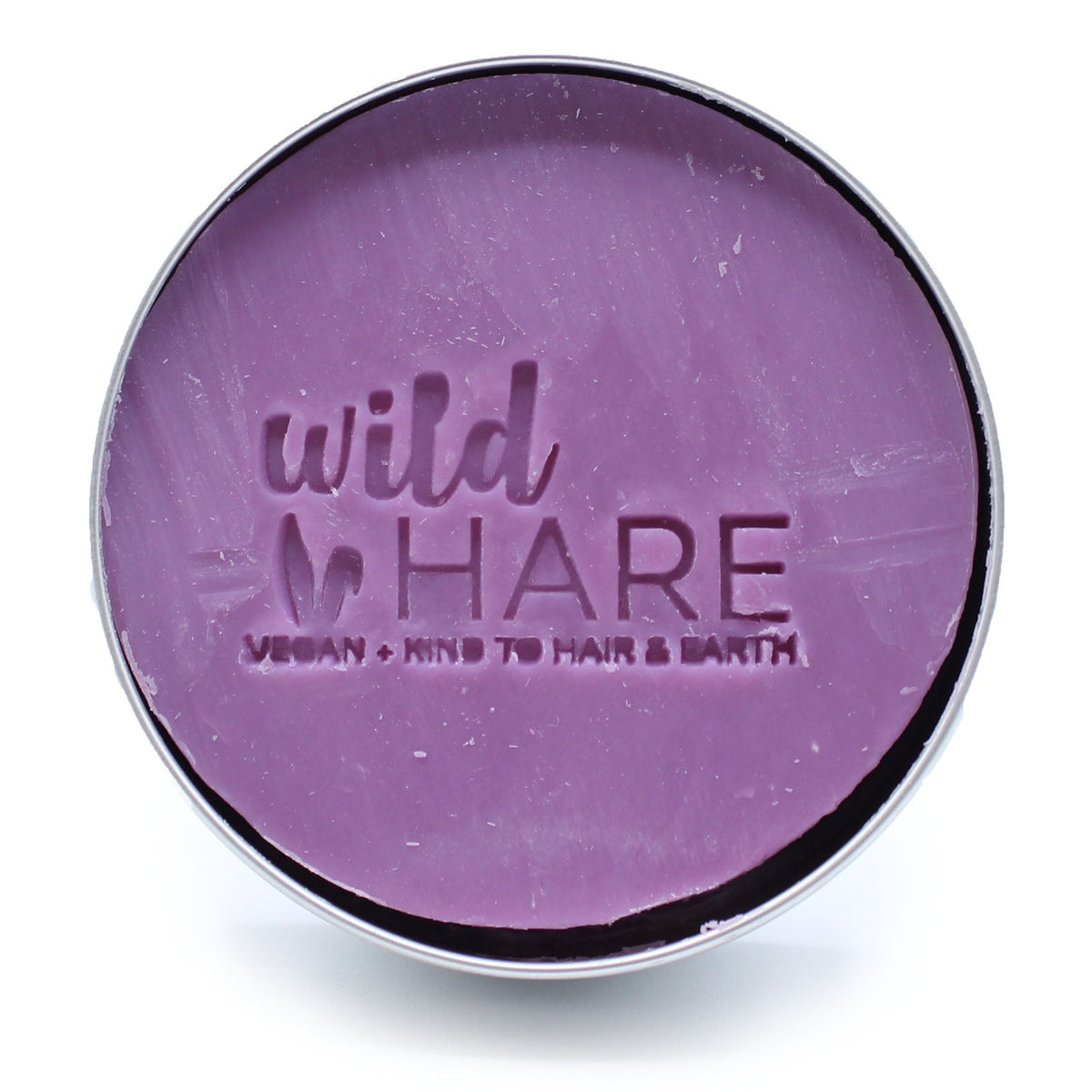 60g Vegan-Friendly Shampoo & Conditioner Bar - Tutti Frutti, purple round bar embossed with the Wild Hare logo in an open tin by Quintessential Holistic Health Ltd