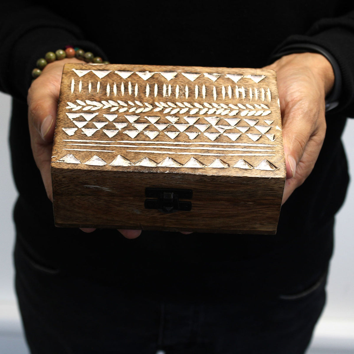 Mango Wood Keepsake Box - Large - Whitewash - Aztec Design, closed box held in two hands with rows of white geometric motifs on the lid by Quintessential Holistic Health Ltd