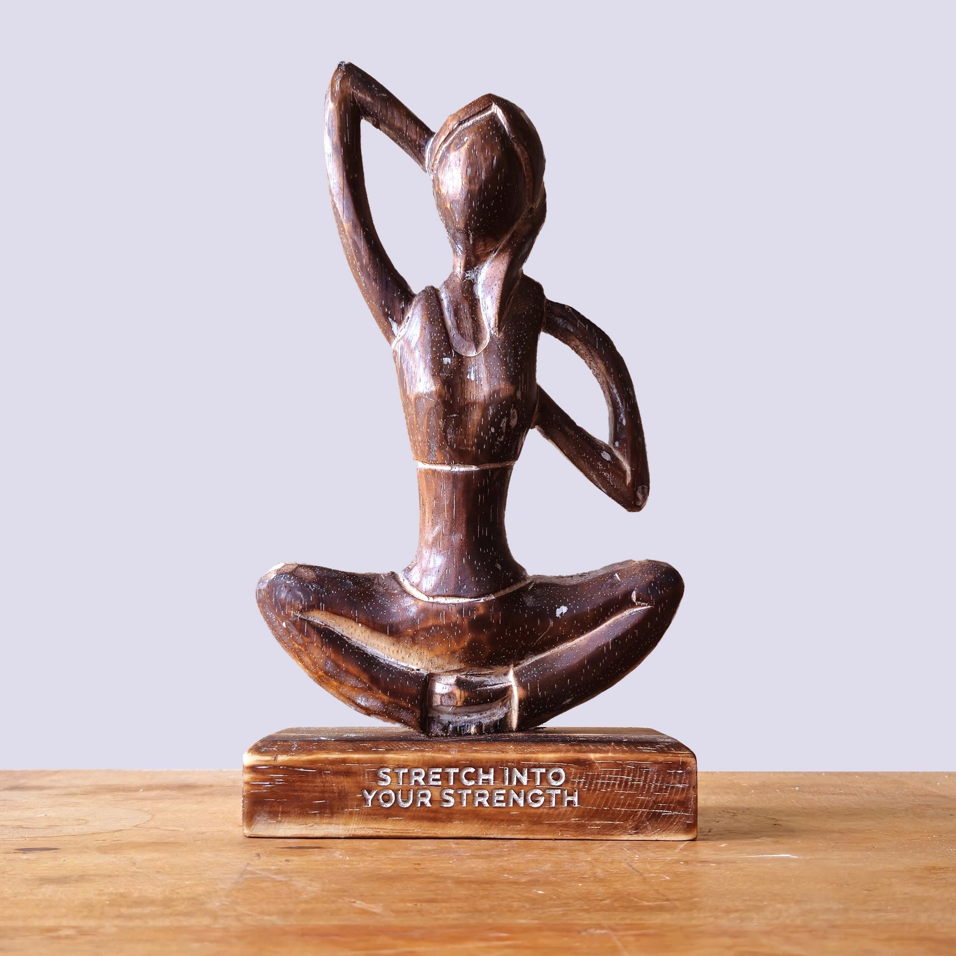 Handmade Eco-Friendly Albasia Wood Yoga Lady - Cow Face Pose / Stretch into Your Strength - Antique Brown product packaging on clean background from Quintessential Holistic Health Ltd