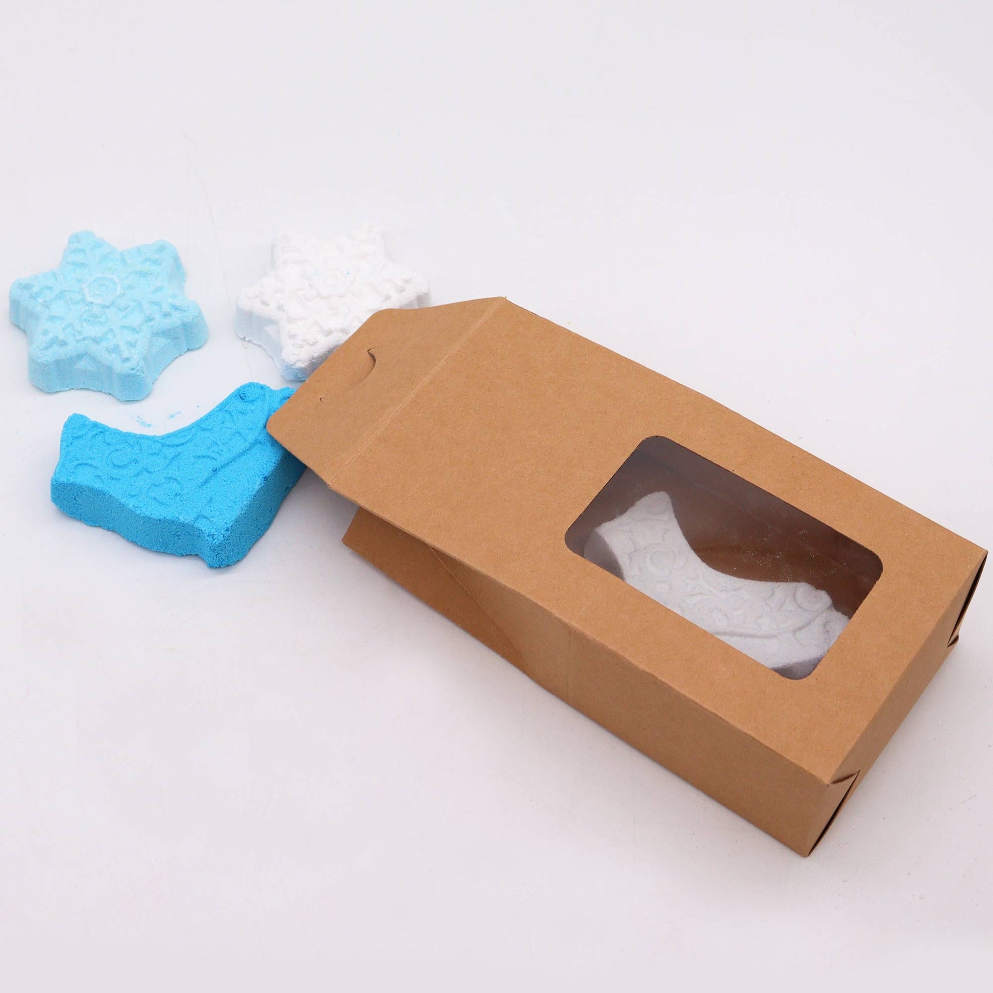 Christmas Bath Bomb Gift Pack - Break the Ice, kraft window box with blue and white snowflake shapes beside it, by Quintessential Holistic Health Ltd