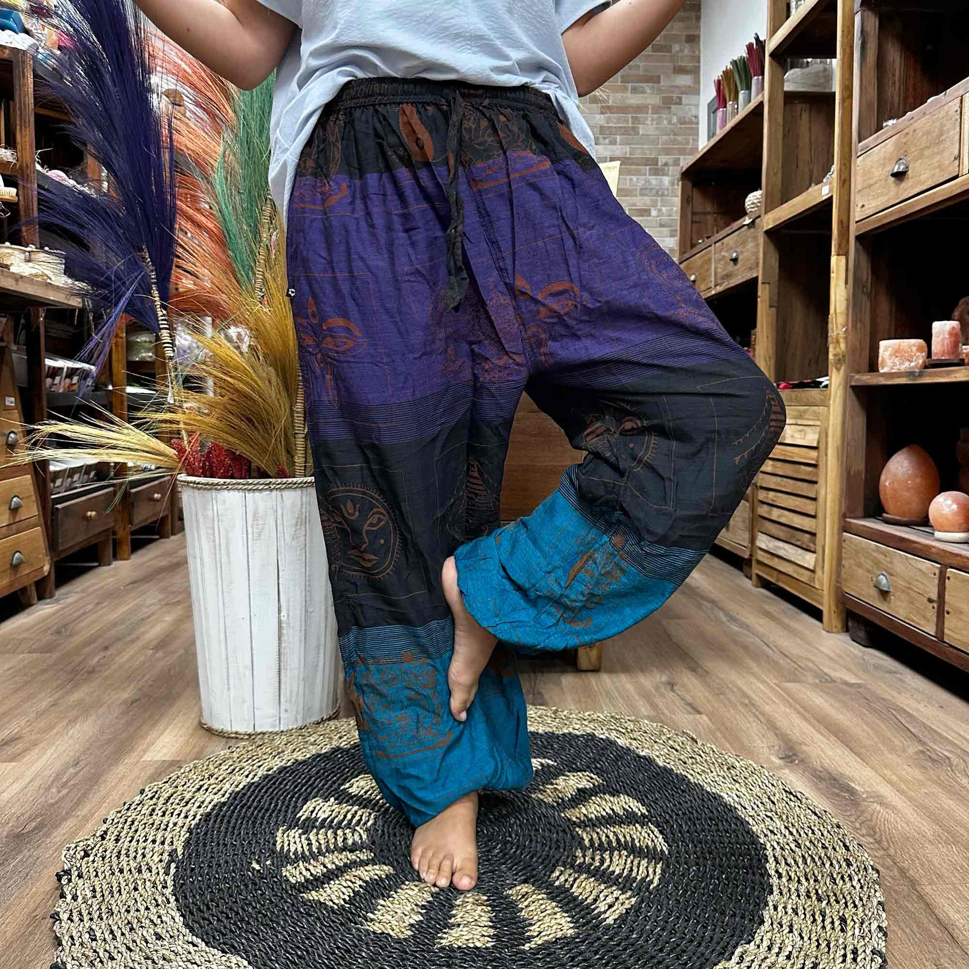 100% Eco-Friendly Cotton Unisex High Cross Style Yoga and Festival Pants - Purple Multicolour / Himalayan Print product packaging on clean background from Quintessential Holistic Health Ltd